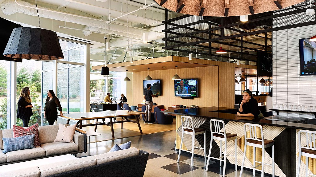 A room with a table and chairs.